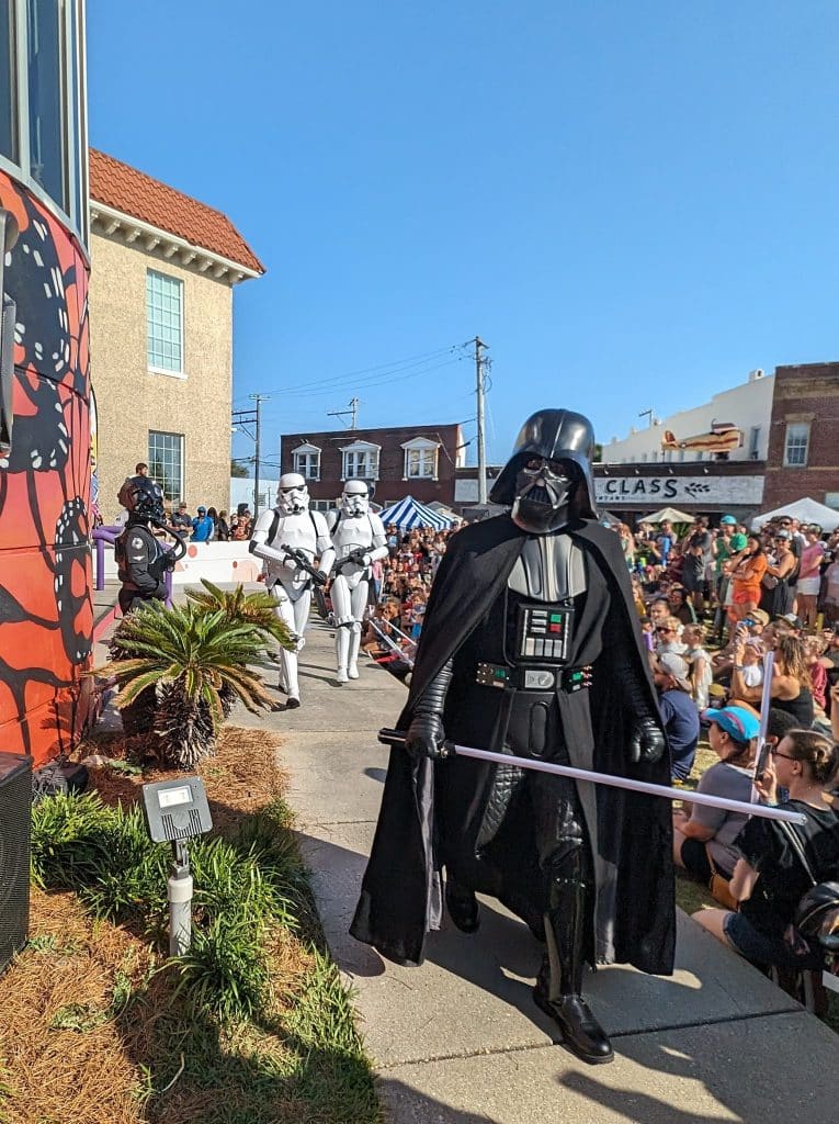 Storm troopers and Jedis walking in front of the crowd near Center for the Arts in downtown Panama City on Star Wars Day