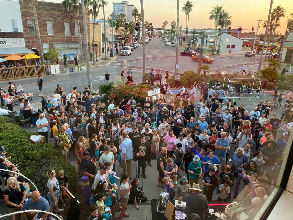Large group of people in downtown Panama City at sunset on Star Wars Day
