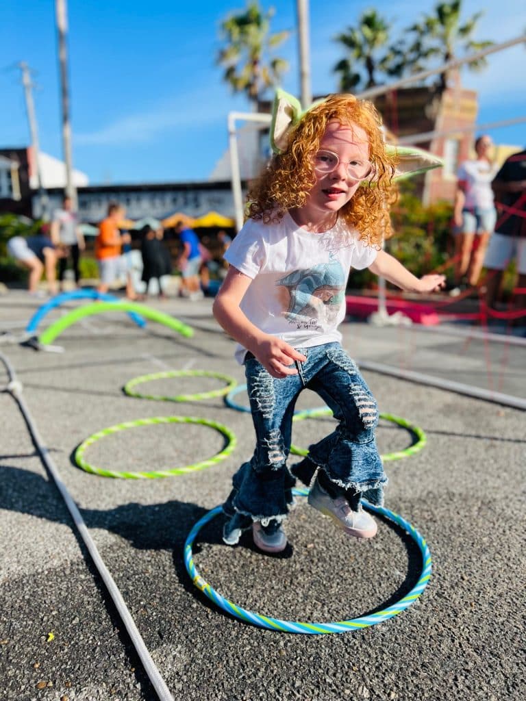 young child enjoying a game in downtown Panama City on Star Wars Day