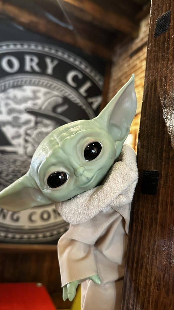 Baby yoda figurine posed at History Class Brewing Company in downtown Panama City