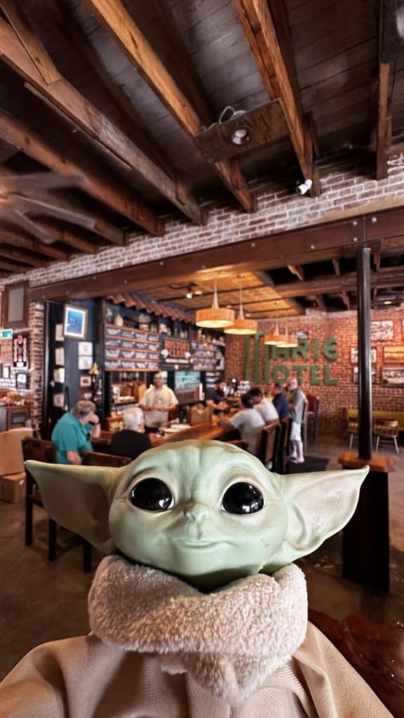 Baby Yoda posed to take a selfie in History Class Brewing Company downtown Panama City for Star Wars Day