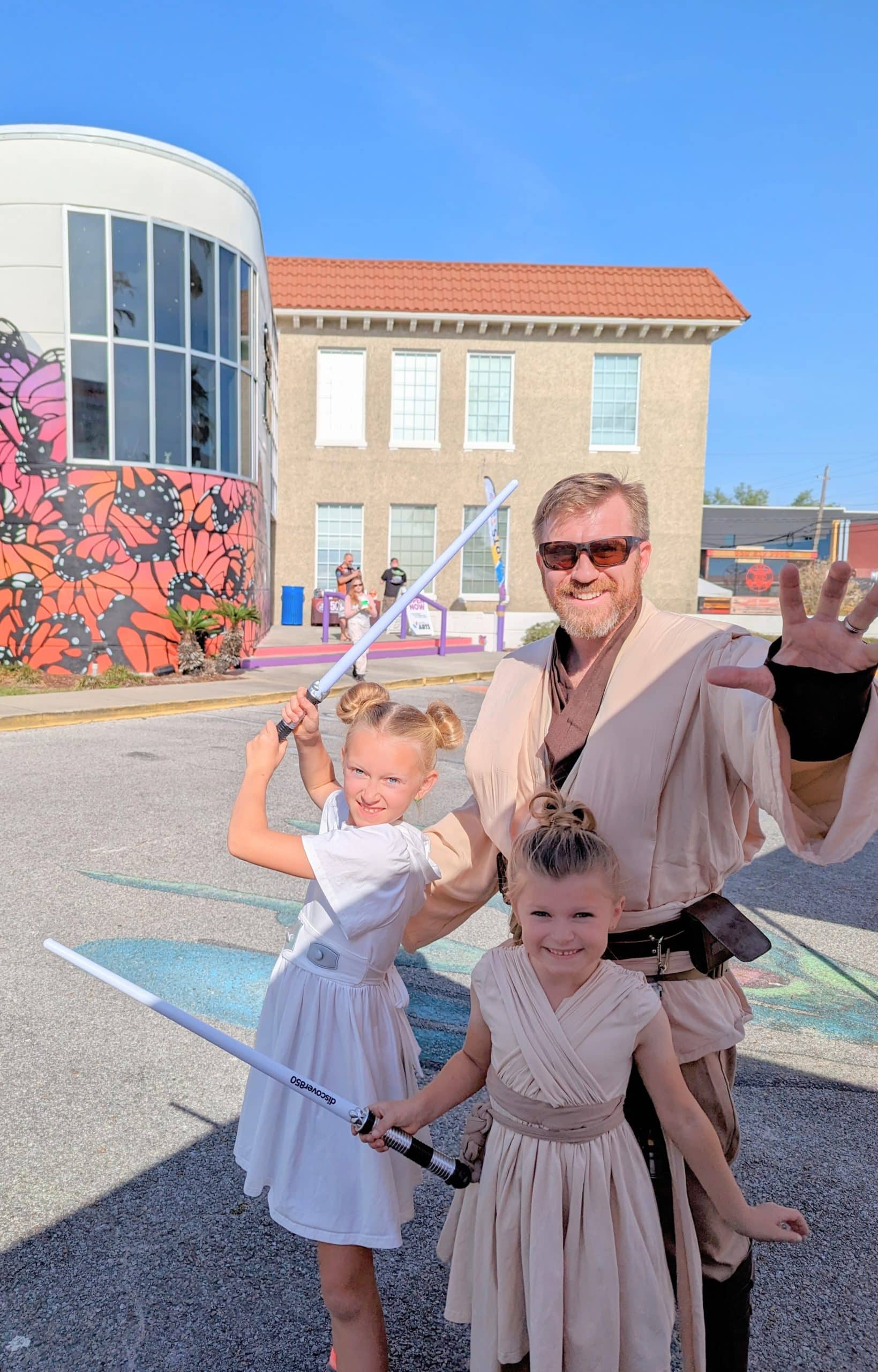 Aaron Rich with his daughters in downtown Panama City dressed up for Star Wars Day