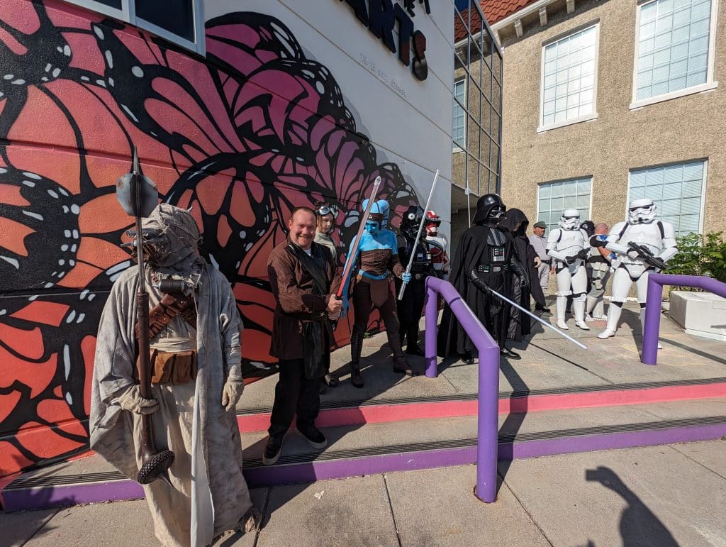 Storm Troopers and other Star Wars characters posing in front of Center for the Arts in downtown Panama City for May the Fourth Event week
