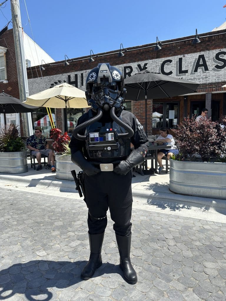 Person dressed as a character from Star Wars posing outstide of History Class Brewing in downtown Panama City on Star Wars Day