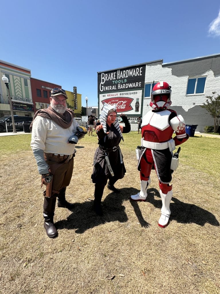 People dresses in Star Wars fan gear enjoying the downtown Panama City Star Wars event near Brake Hardware